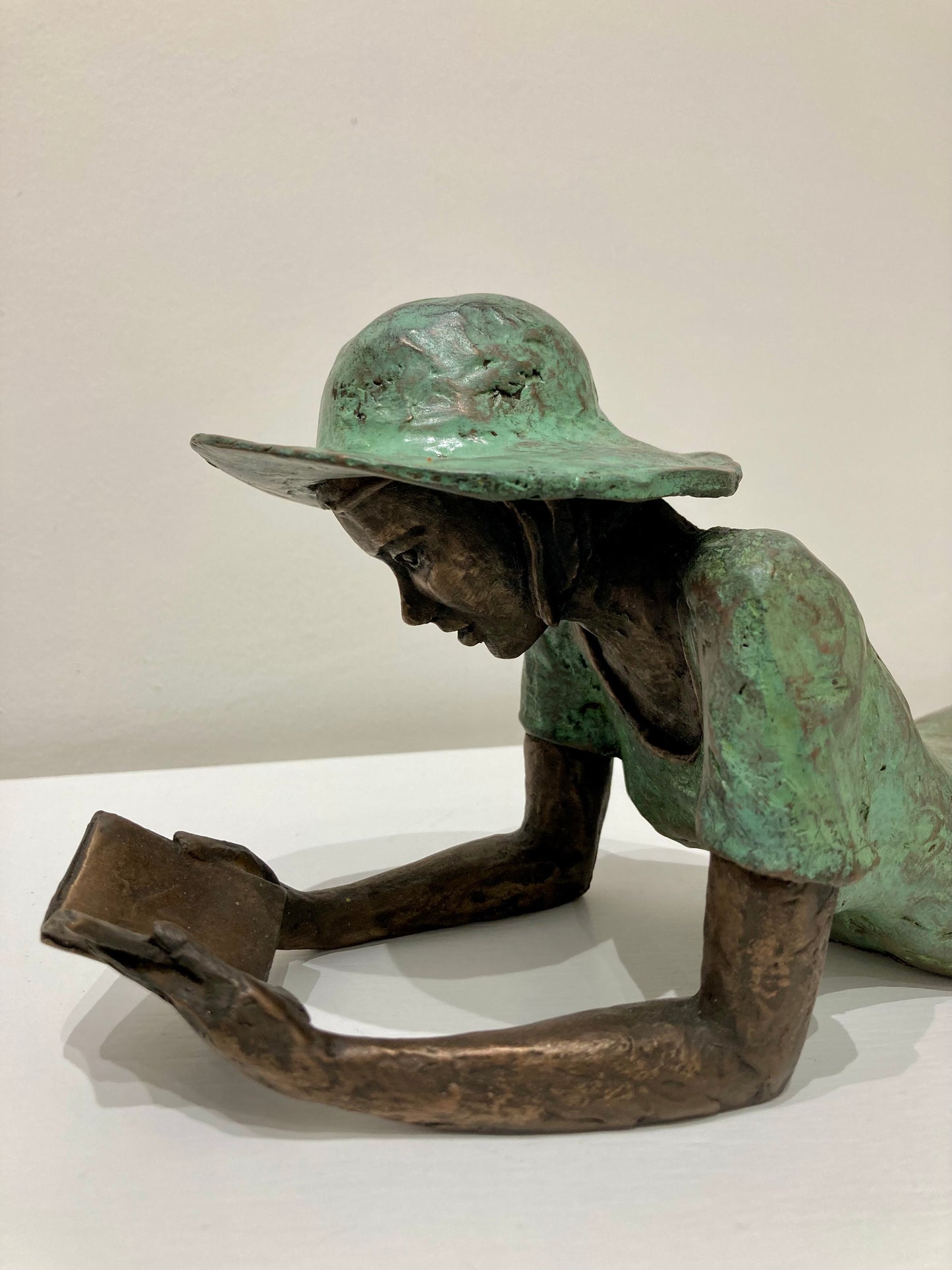 Reading Girl in a Hat - bronze and verdigris