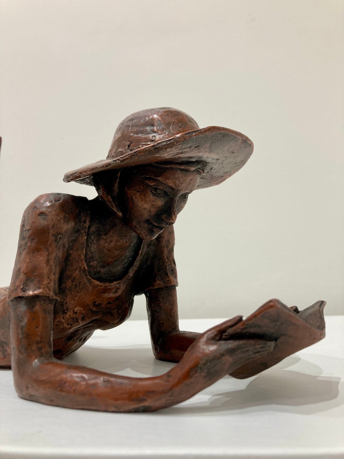 Reading Girl in a Hat - copper finish